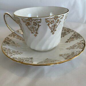 SUTHERLAND and DELPHINE tea cup and saucer set, England. Vintage.